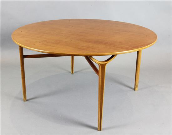 A 1960s teak centre table, diameter 3ft 6.5in. H.1ft 10in.